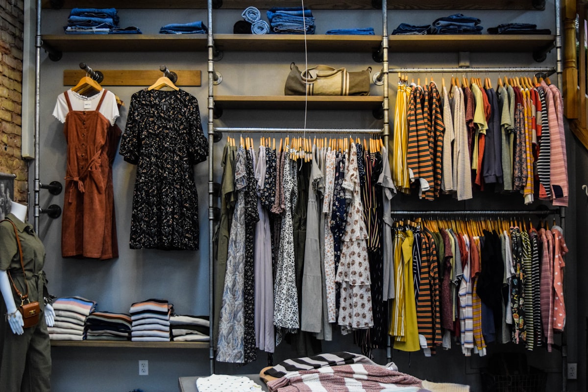 An organised walk-in closet full of clothes