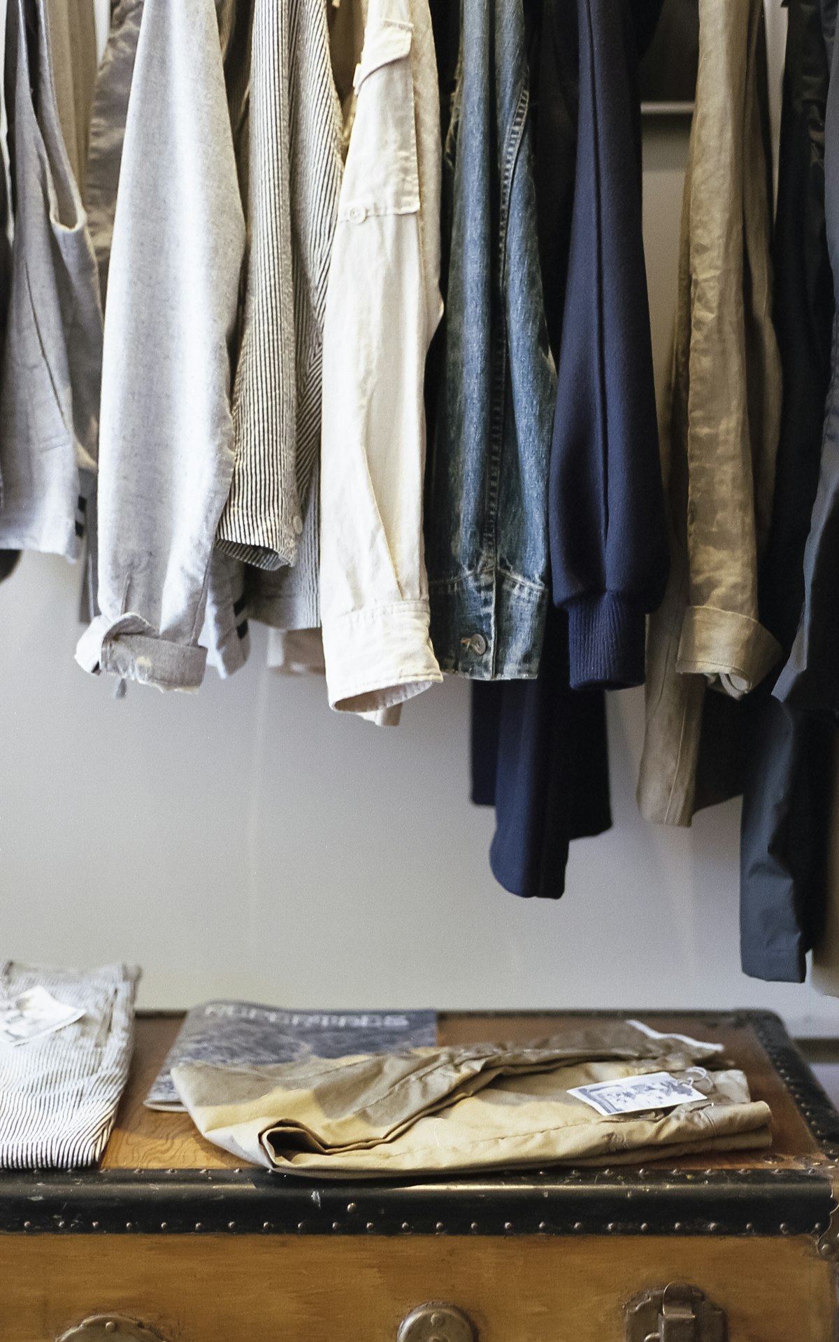 A neutral rail of clothes in a circular wardrobe