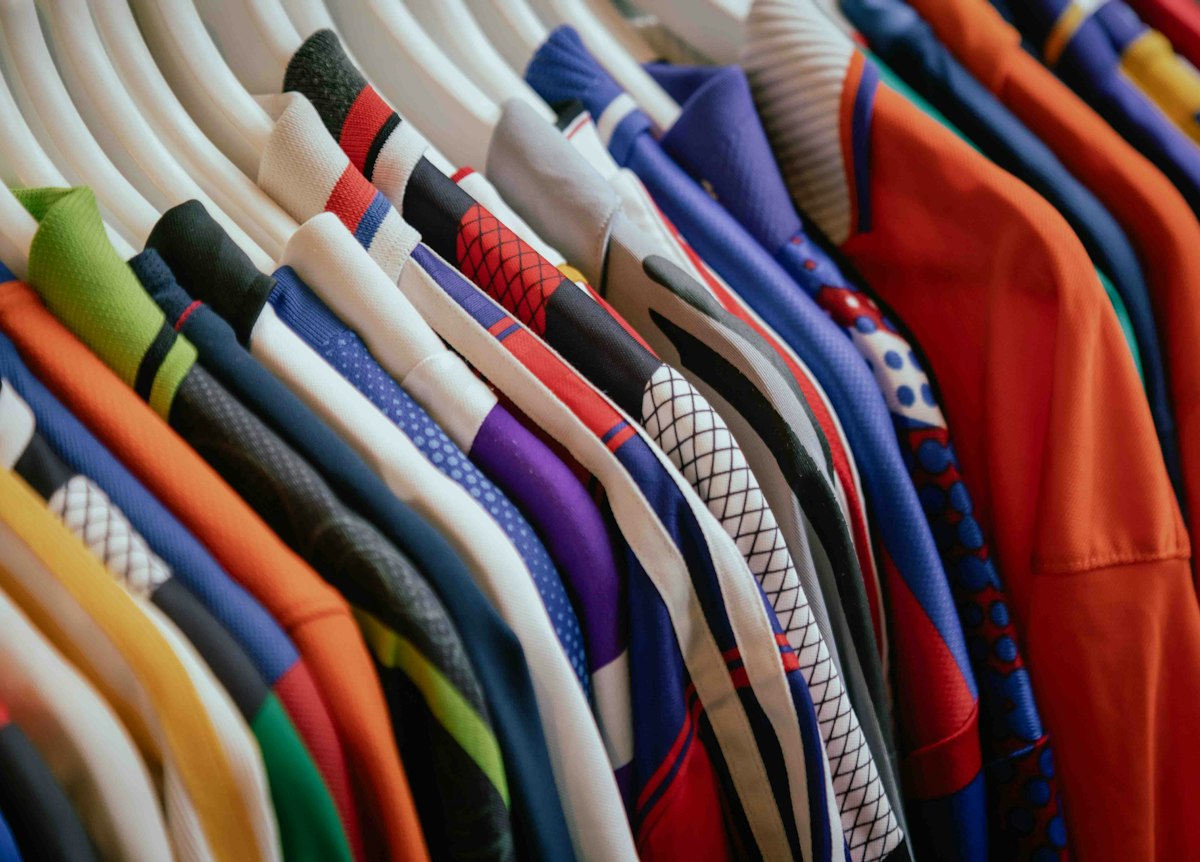 A rail of shirts in many different colours