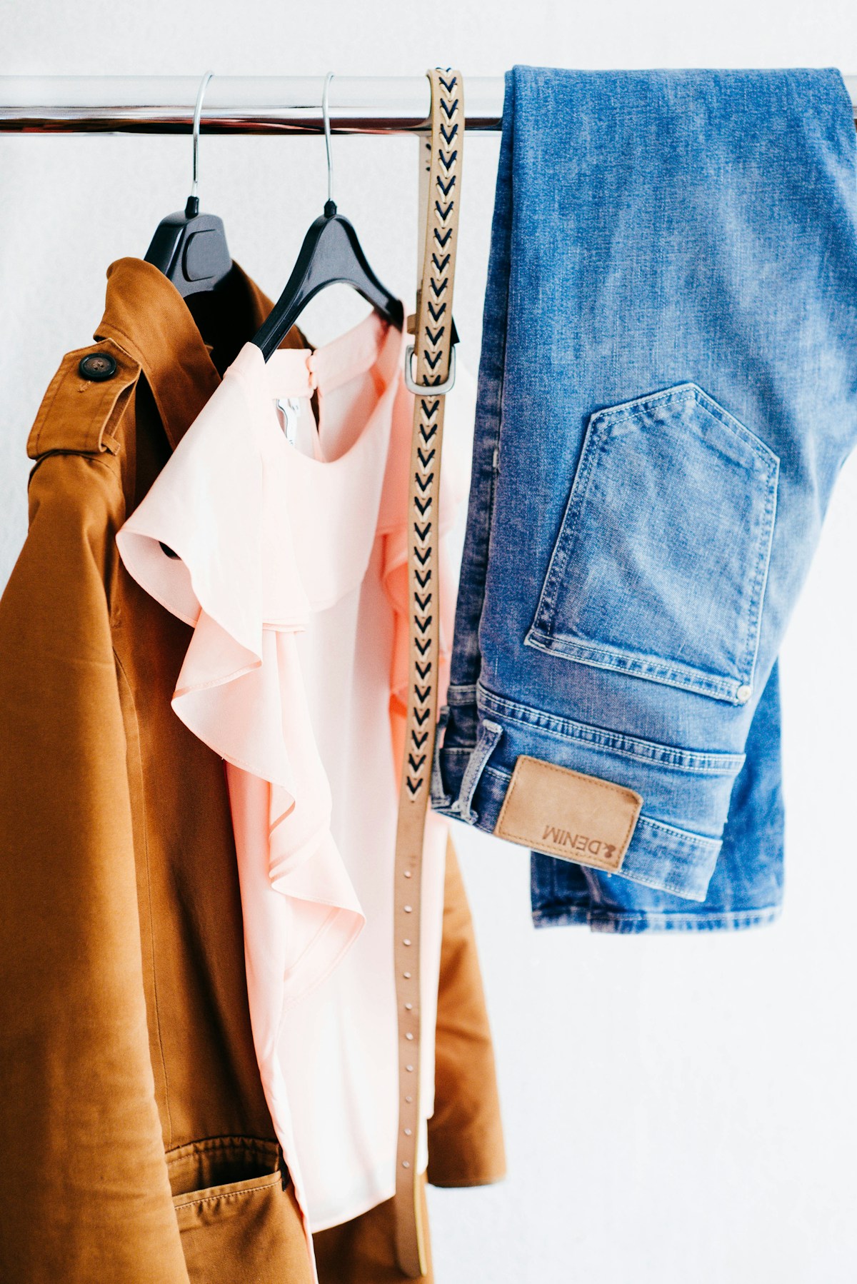 Assorted clothes hanging on a clothes rack