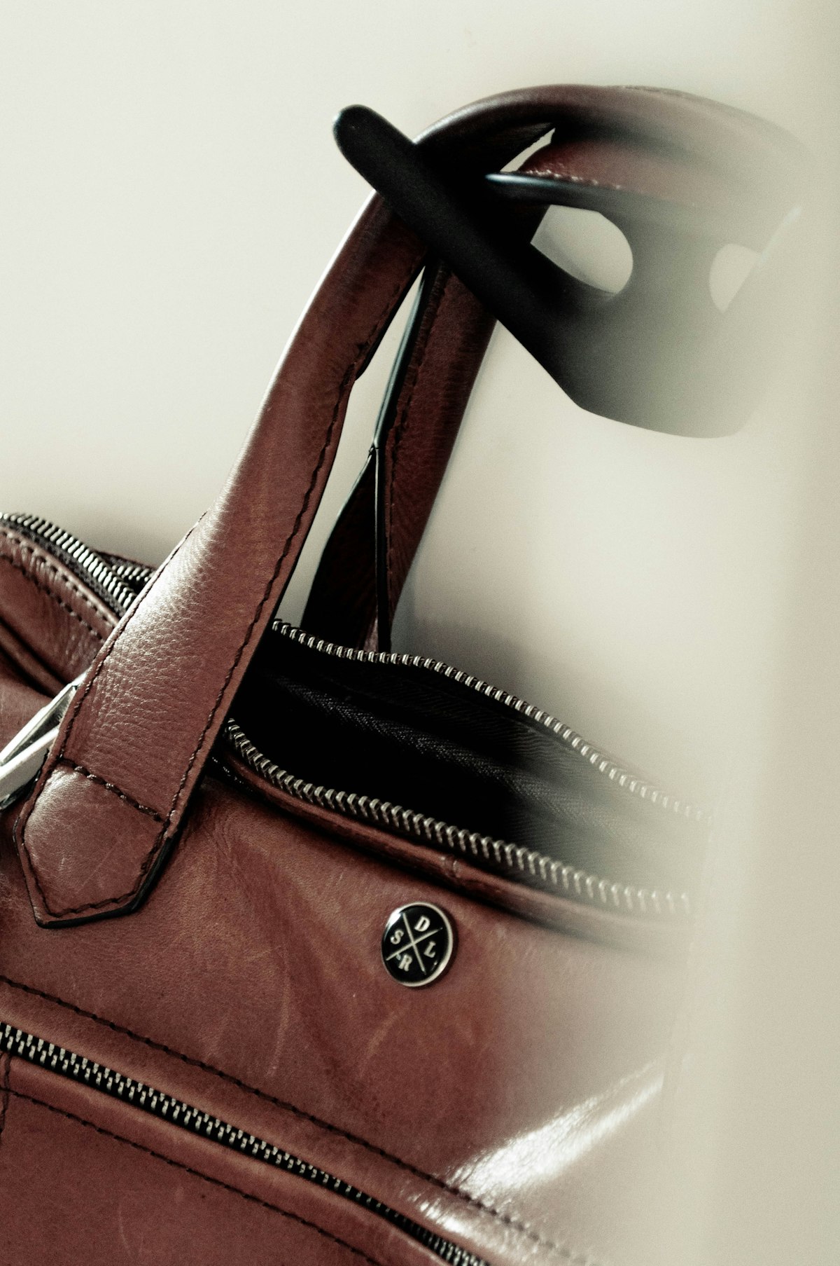 A brown leather tote bag